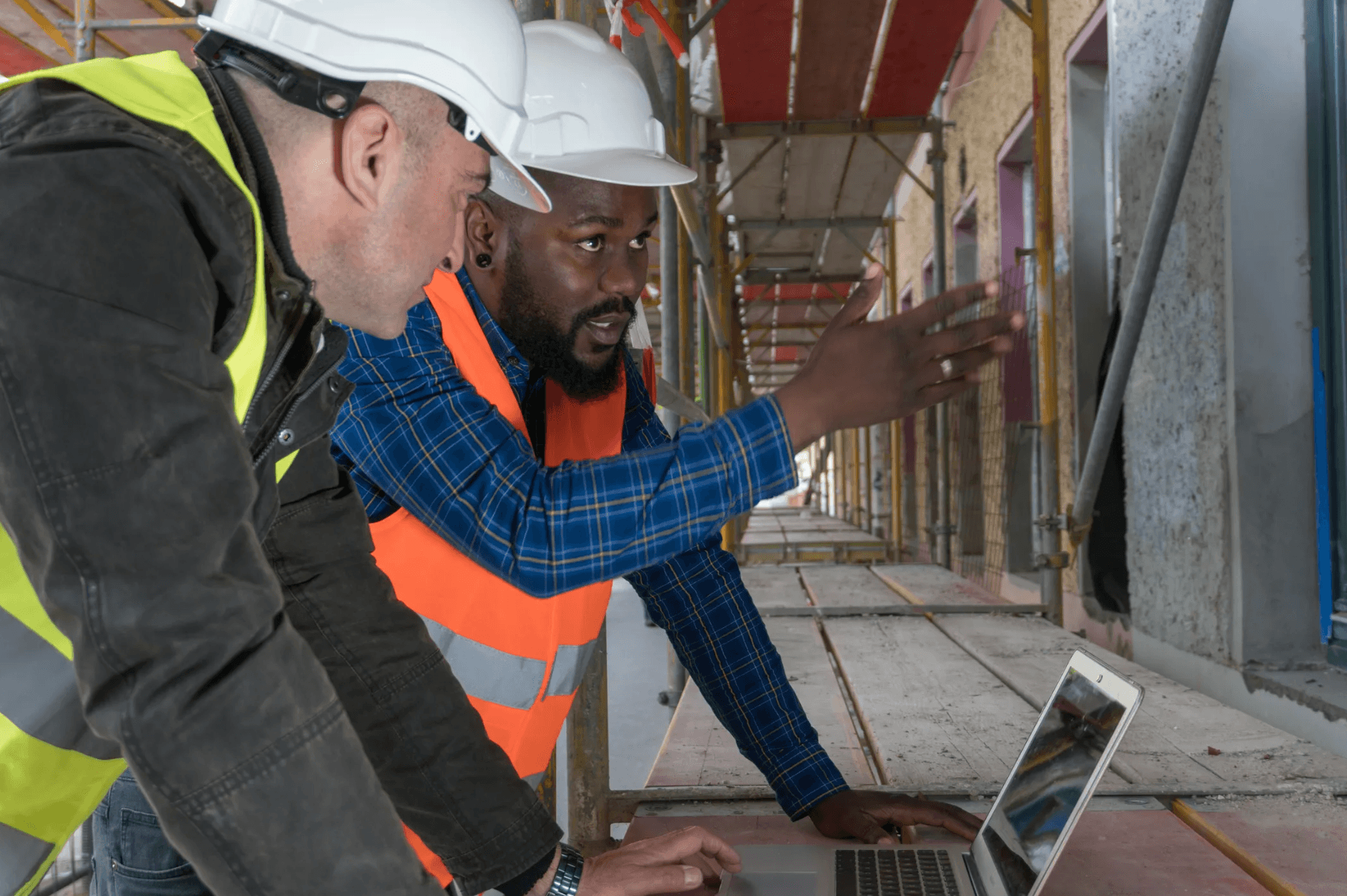 Construction workers conducting field inspection