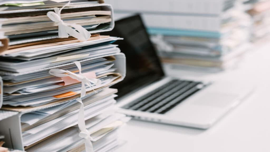 Paper documents representing traditional workflows